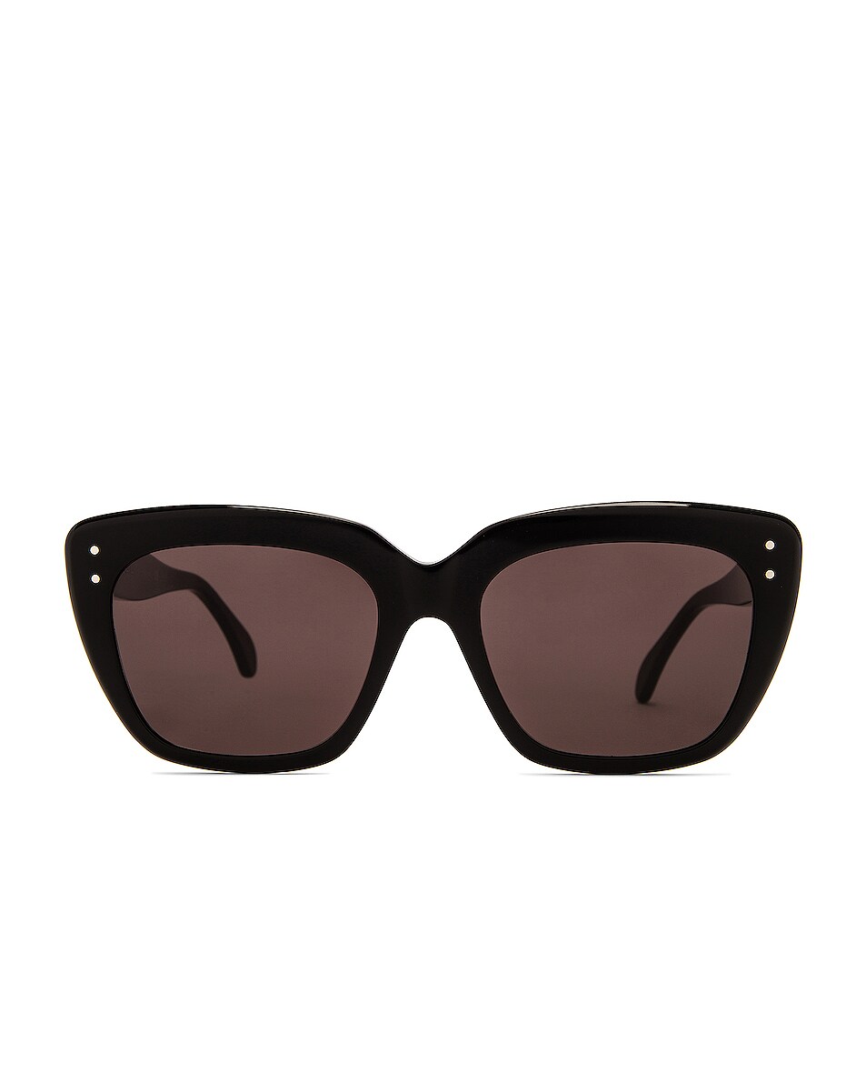 Image 1 of ALAÏA Stud Cat Eye Sunglasses in Shiny Black