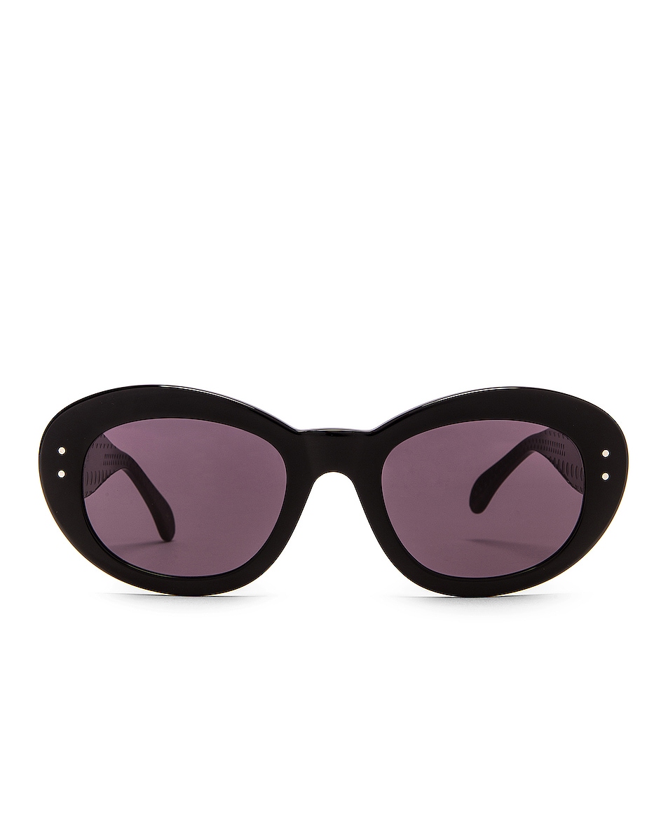 Image 1 of ALAÏA Oval Sunglasses in Shiny Black