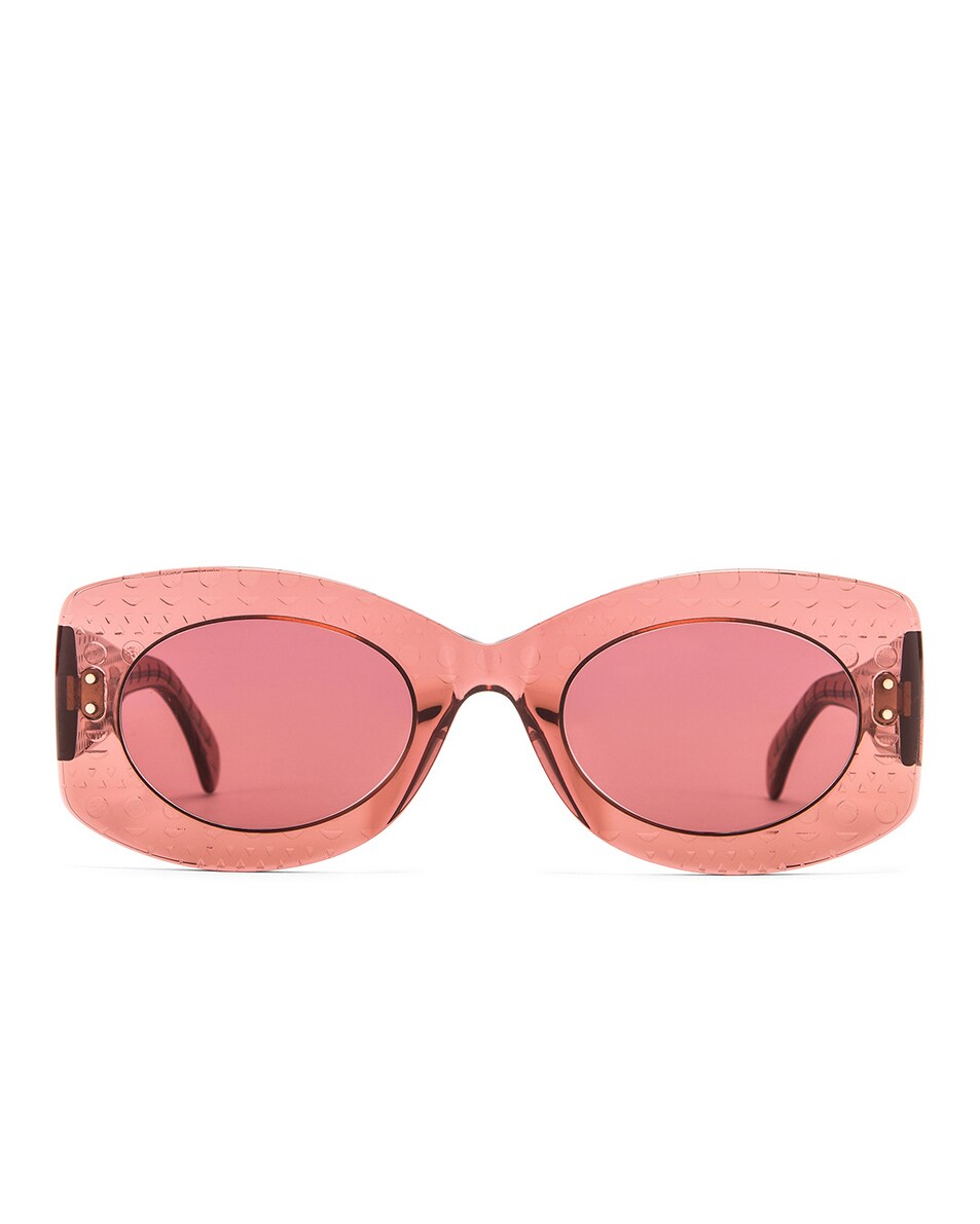 Image 1 of ALAÏA Soft Round Stud Sunglasses in Shiny Brown