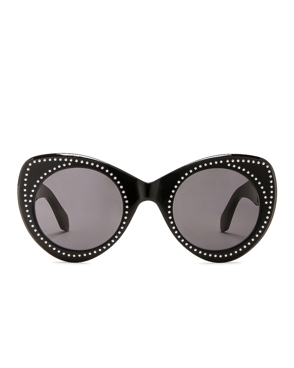 Image 1 of ALAÏA Round Acetate Sunglasses in Shiny Solid Black