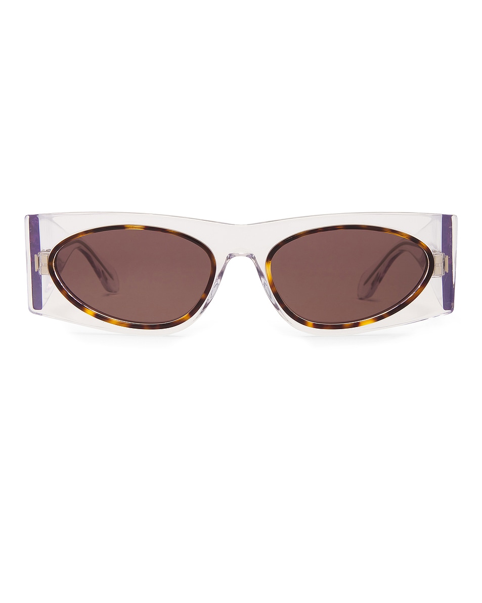 Image 1 of ALAÏA Oval Transparent Sunglasses in Crystal & Grey