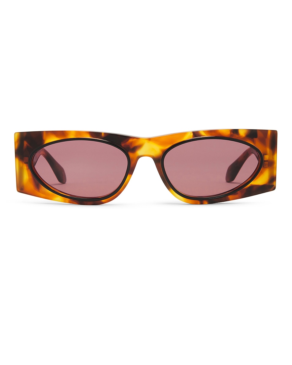 Image 1 of ALAÏA Oval Transparent Sunglasses in Havana & Red