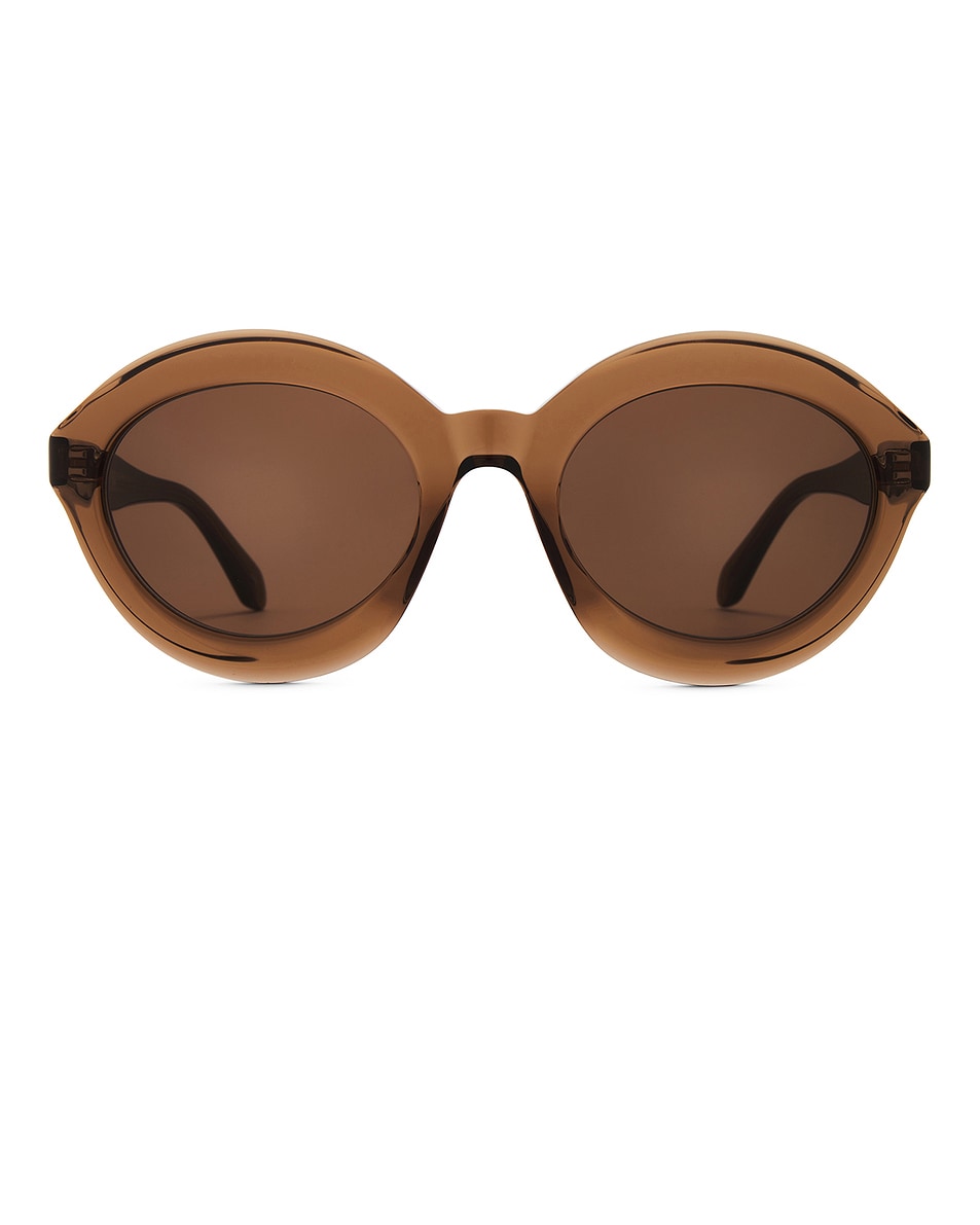 Image 1 of ALAÏA ALAЇA Round Sunglasses in Brown