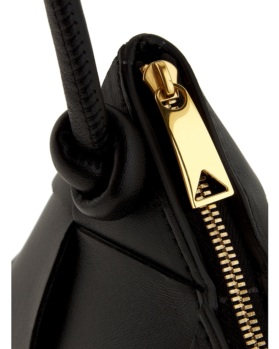 Bottega Veneta Baguette Pouch On Strap in Black & Gold | FWRD