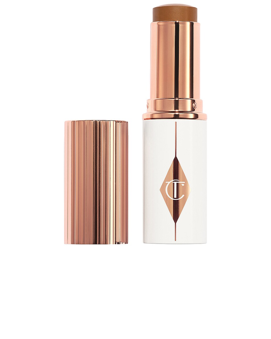 Image 1 of Charlotte Tilbury Unreal Skin Sheer Glow Tint Hydrating Foundation Stick in 13 Deep