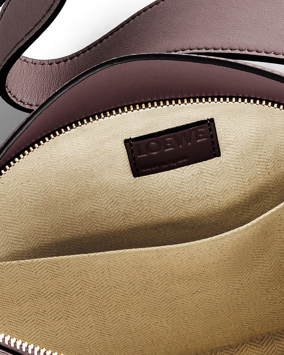 Loewe Puzzle Hobo Bag in Prune FWRD