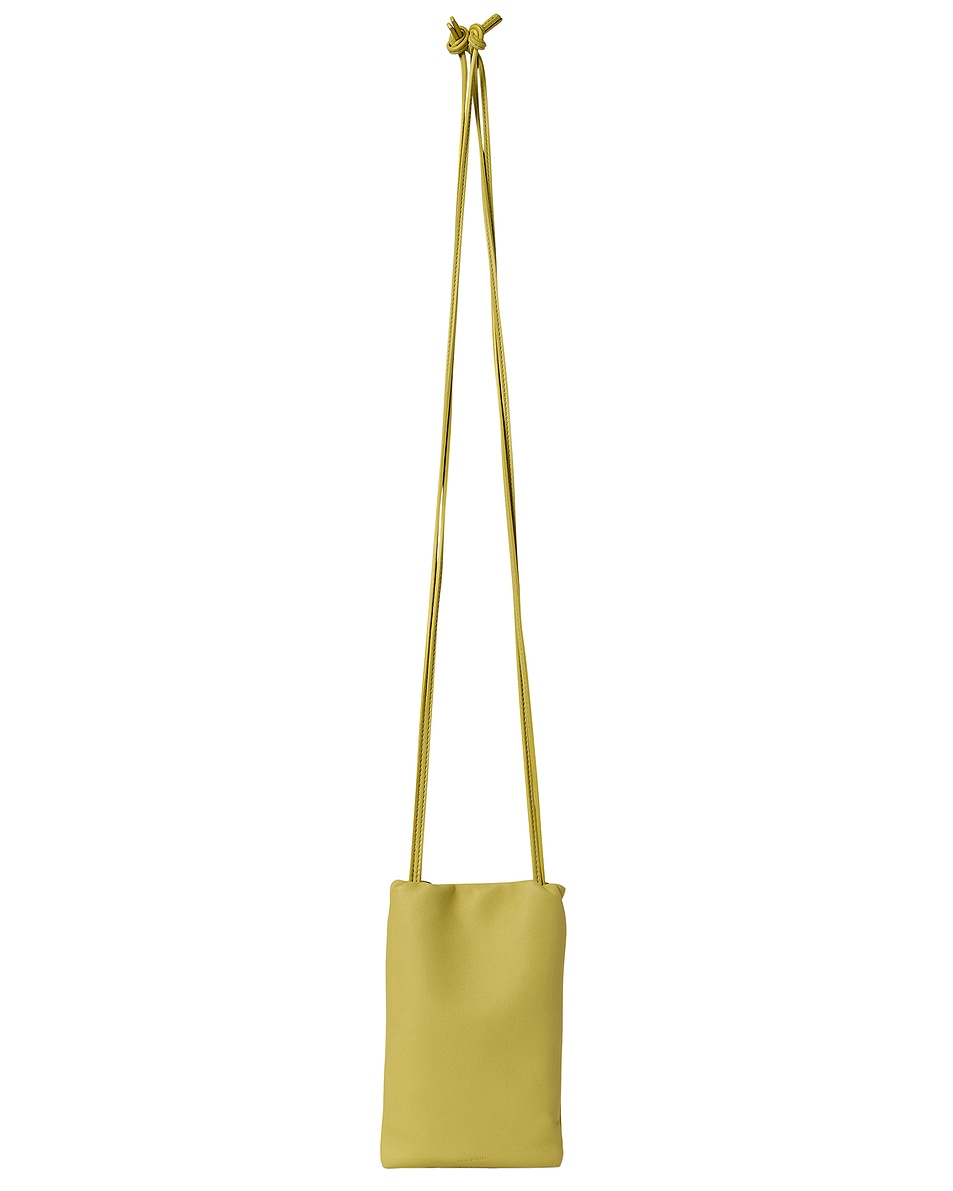 Image 1 of The Row Bourse Phone Case in Coppery Yellow ANS