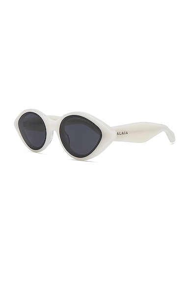Shop Alaïa Lettering Logo Oval Sunglasses In White & Grey