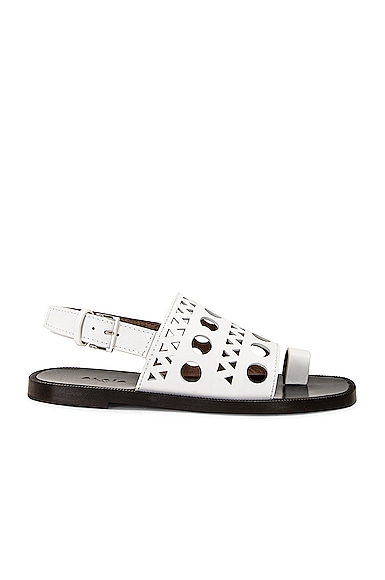 ALAÏA Perforated Flat Sandal in Blanc Casse