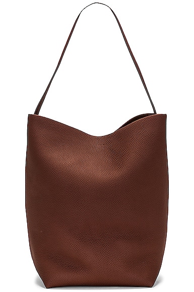 The Row Large N/S Park Tote Bag in Cognac PLD | FWRD
