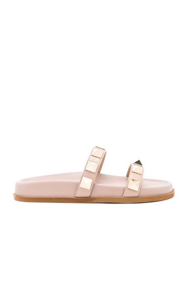 Valentino Garavani Leather Rockstud Lock Slides in Poudre FWRD