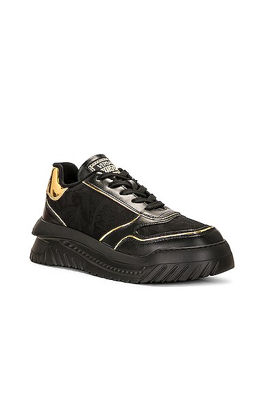 Shop Versace Low Top Sneaker In Black & Gold