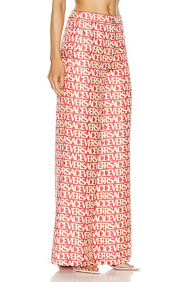 Shop Versace All Over Logo Pant In Fuchsia & Ivory
