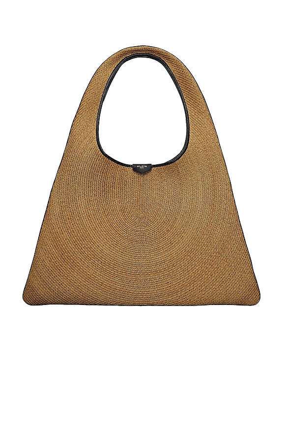 ALAÏA One Piece Hobo Bag in Brun Fonce | FWRD