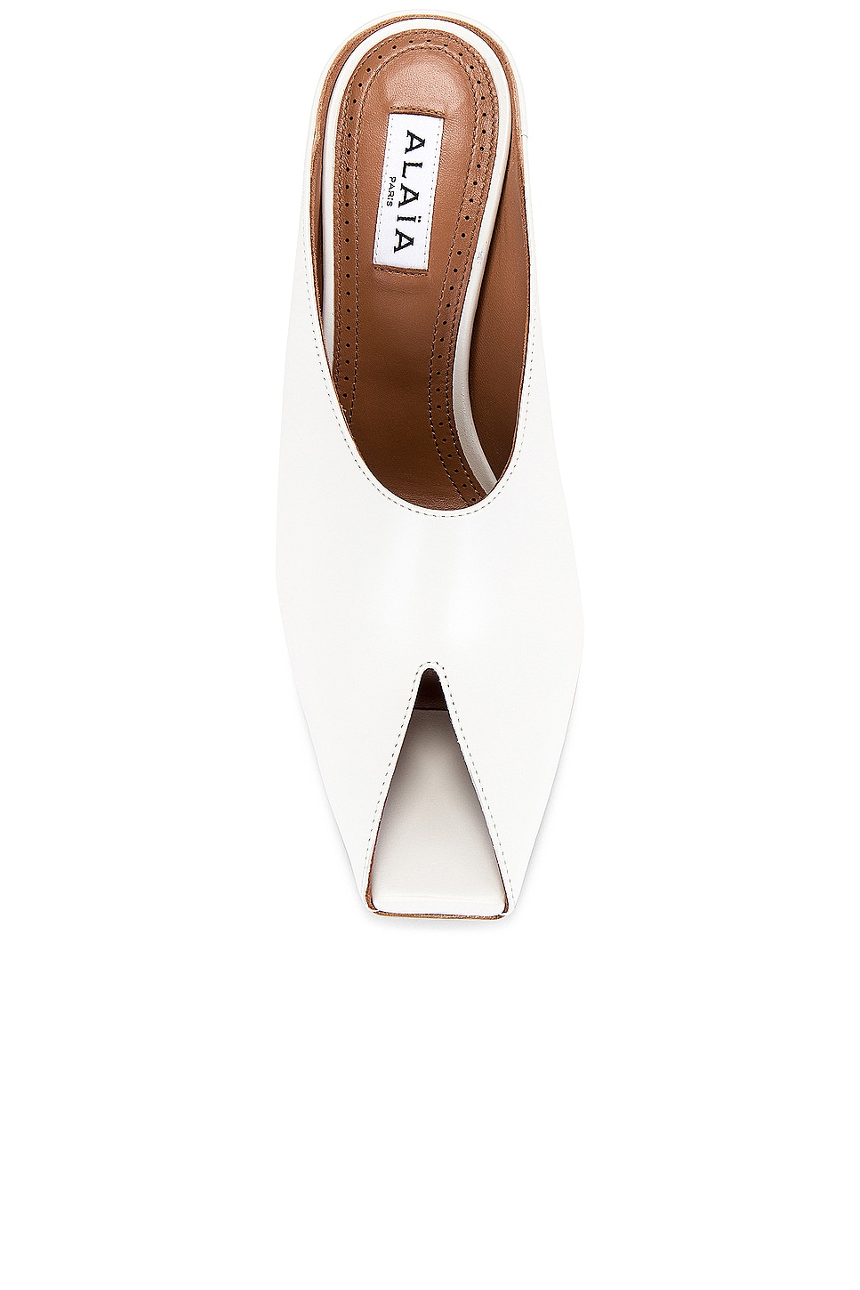ALAIA FLAT MULE IN LEOPARD LAMBSKIN