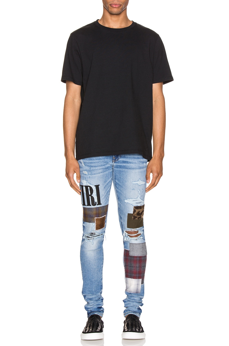 amiri patched jeans