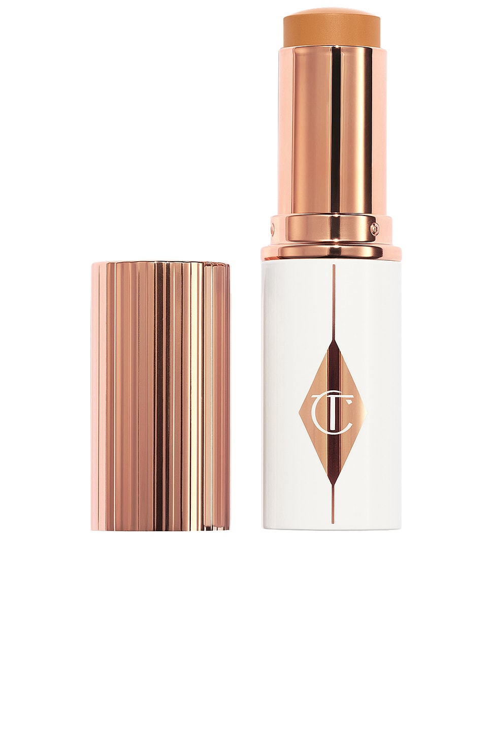 Shop Charlotte Tilbury Unreal Skin Sheer Glow Tint Hydrating Foundation Stick In 10 Tan