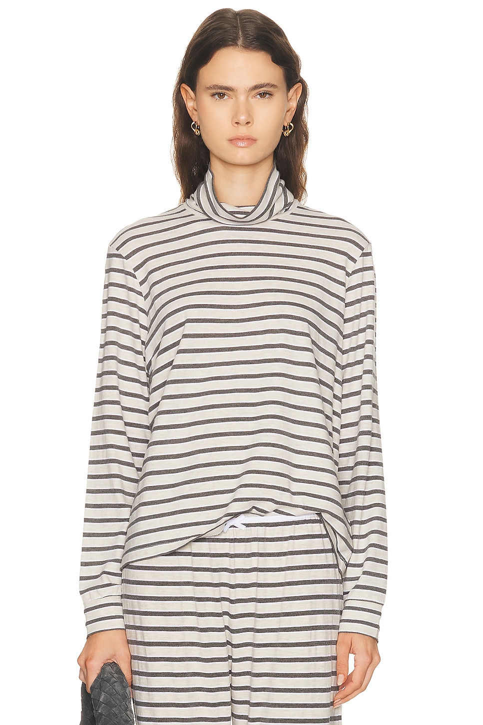Image 1 of DONNI. The Stripe Jersey Turtleneck Top in Oatmeal