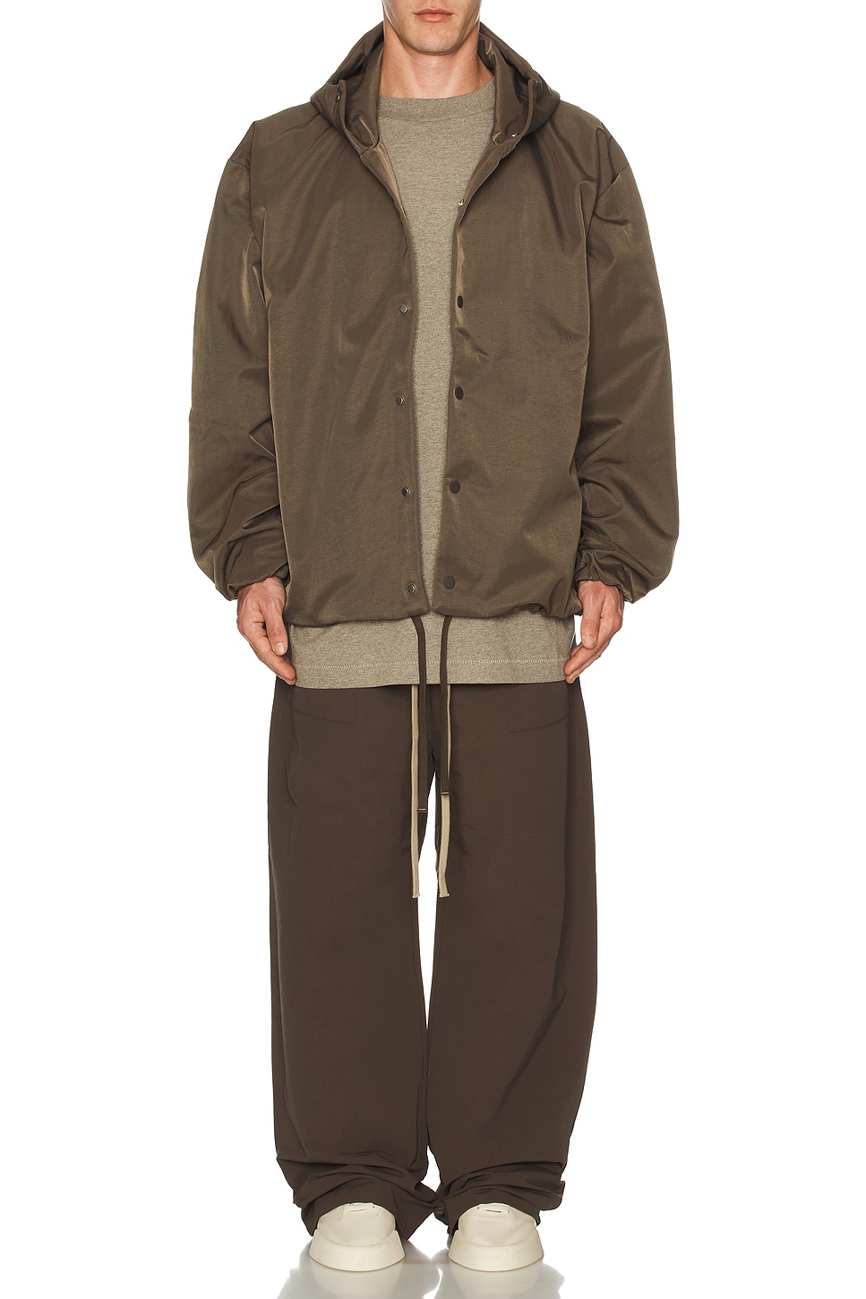 Image 1 of Fear of God ESSENTIALS Textured Nylon Hooded Coaches Jacket in Brown