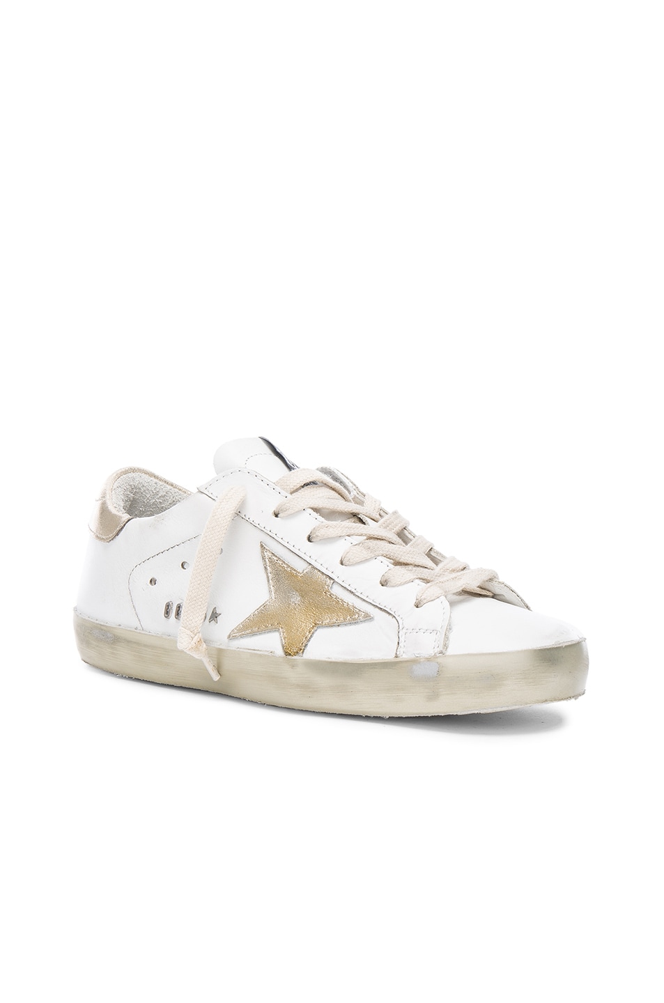 white sneakers gold stars
