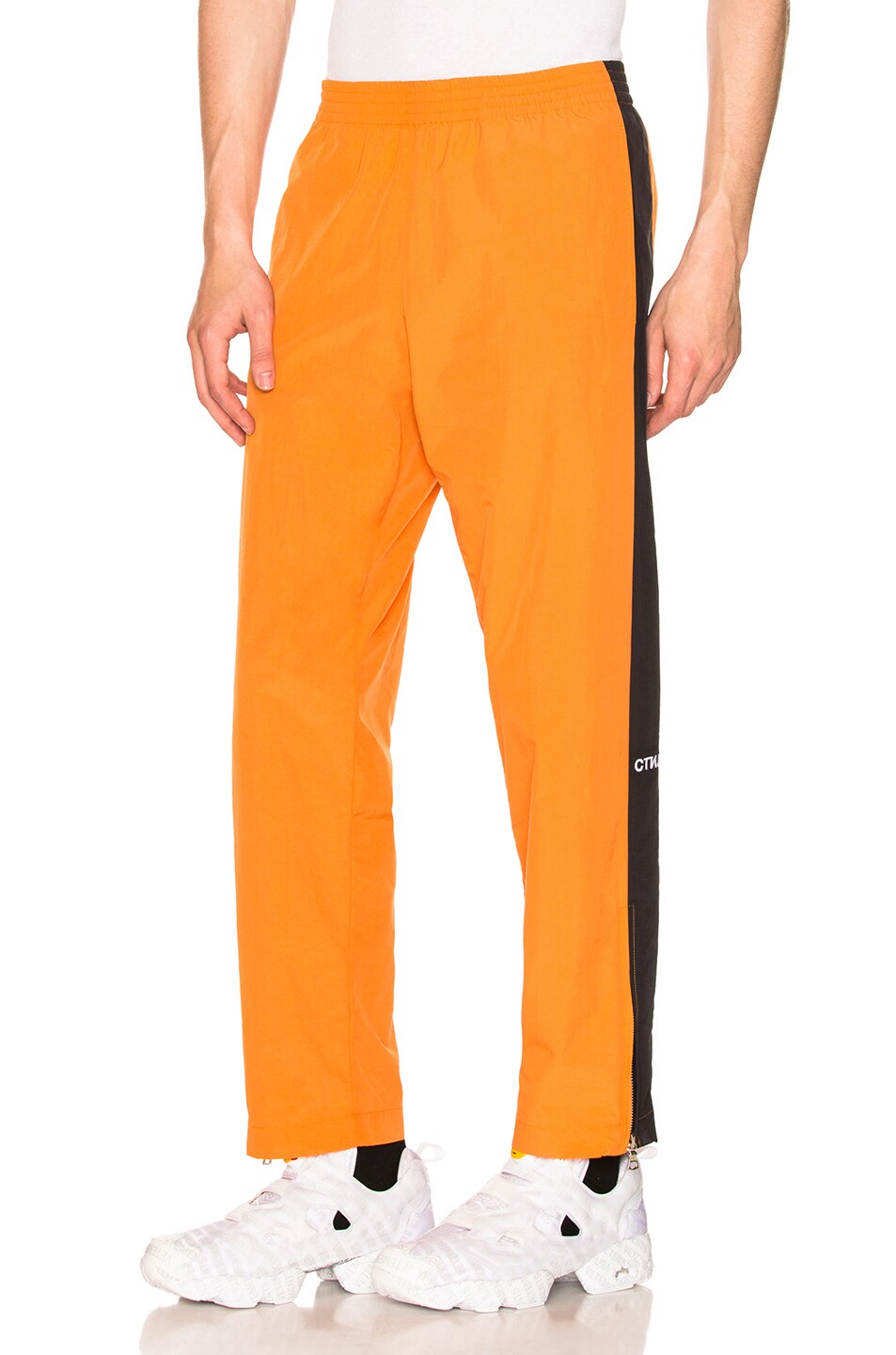 Image 1 of Heron Preston "Style" Side Stripe Loose Pants in Orange