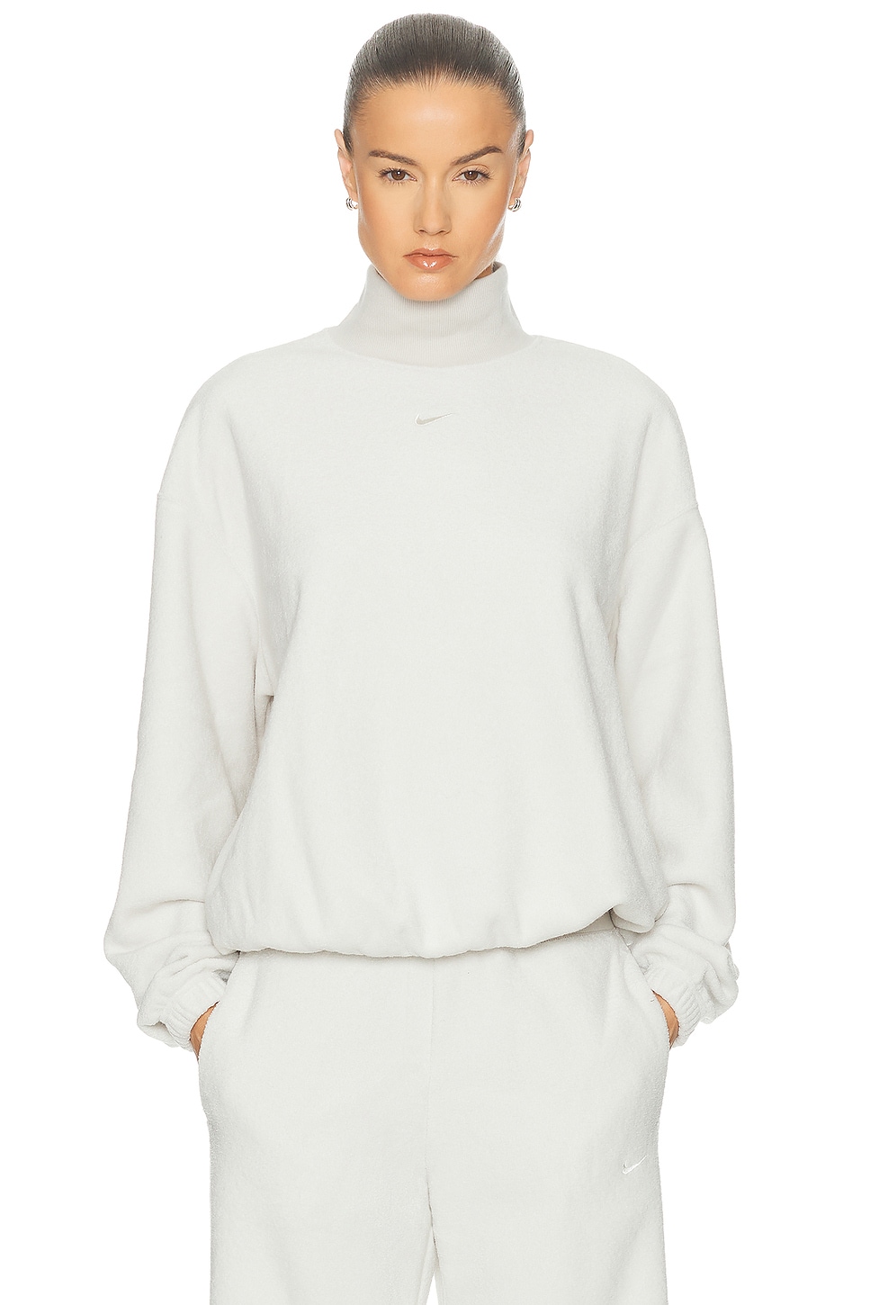 Image 1 of Nike Cozy Oversized Long Sleeve Mock Neck Top in Light Bone & Sail