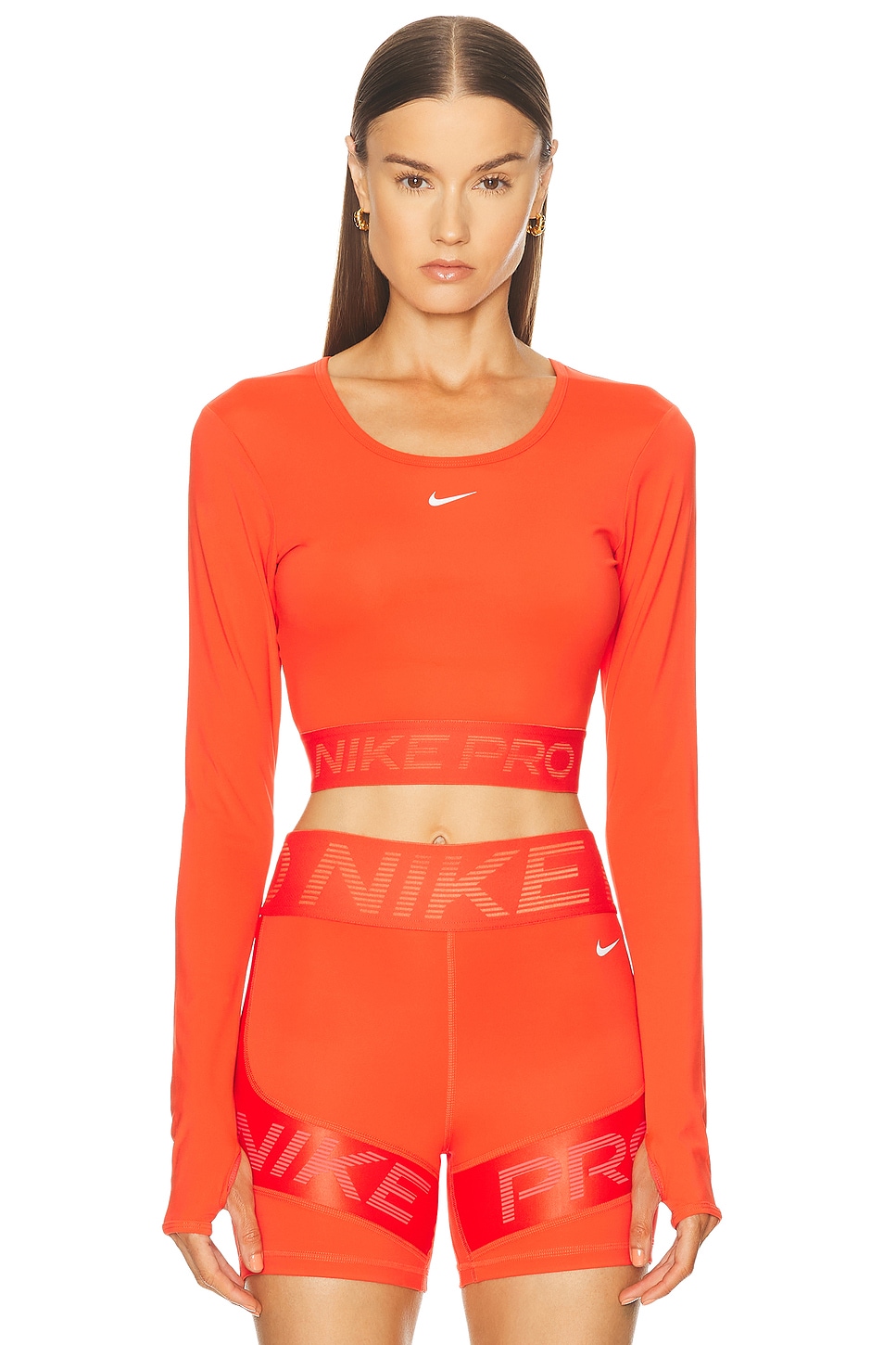 Image 1 of Nike Dri-FIT Cropped Long Sleeve Top in Light Crimson, Ember Glow, & White