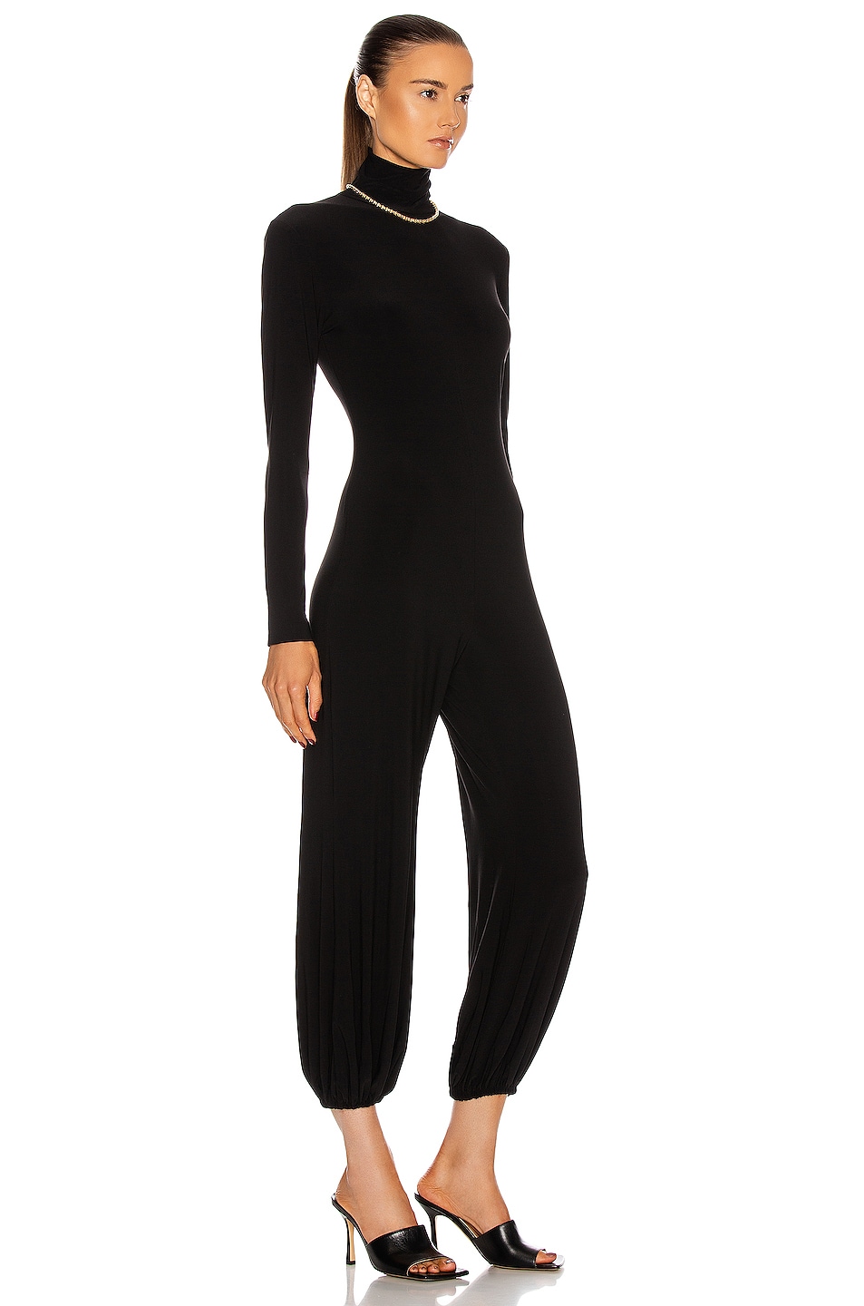 Norma Kamali Turtleneck Jog Jumpsuit in Black | FWRD