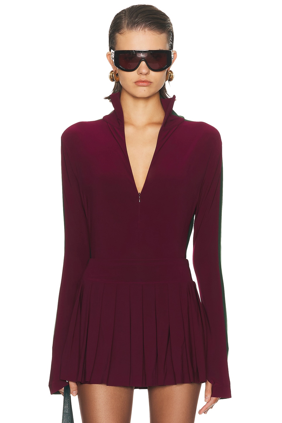 Image 1 of Norma Kamali Side Stripe Zip Front Long Sleeve Turtleneck Bodysuit in Plum & Dark Emerald