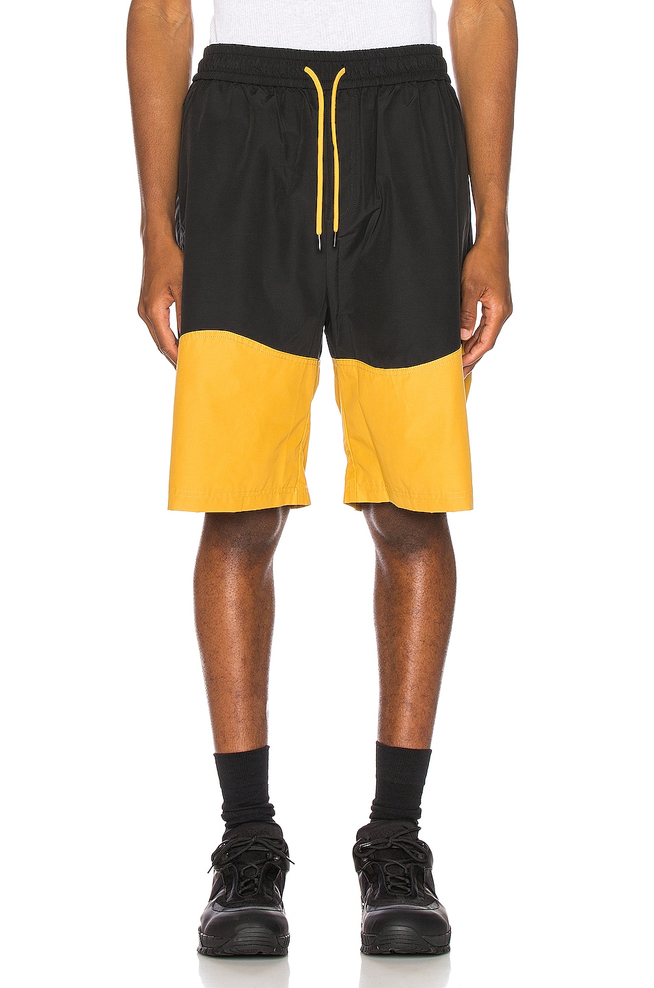Image 1 of Pyer Moss Wave Panel Track Shorts in Black & Yellow
