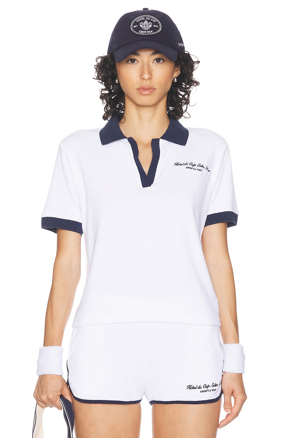 Image 1 of Sporty & Rich Hotel Du Cap Cursive Terry Polo Top in White & Navy
