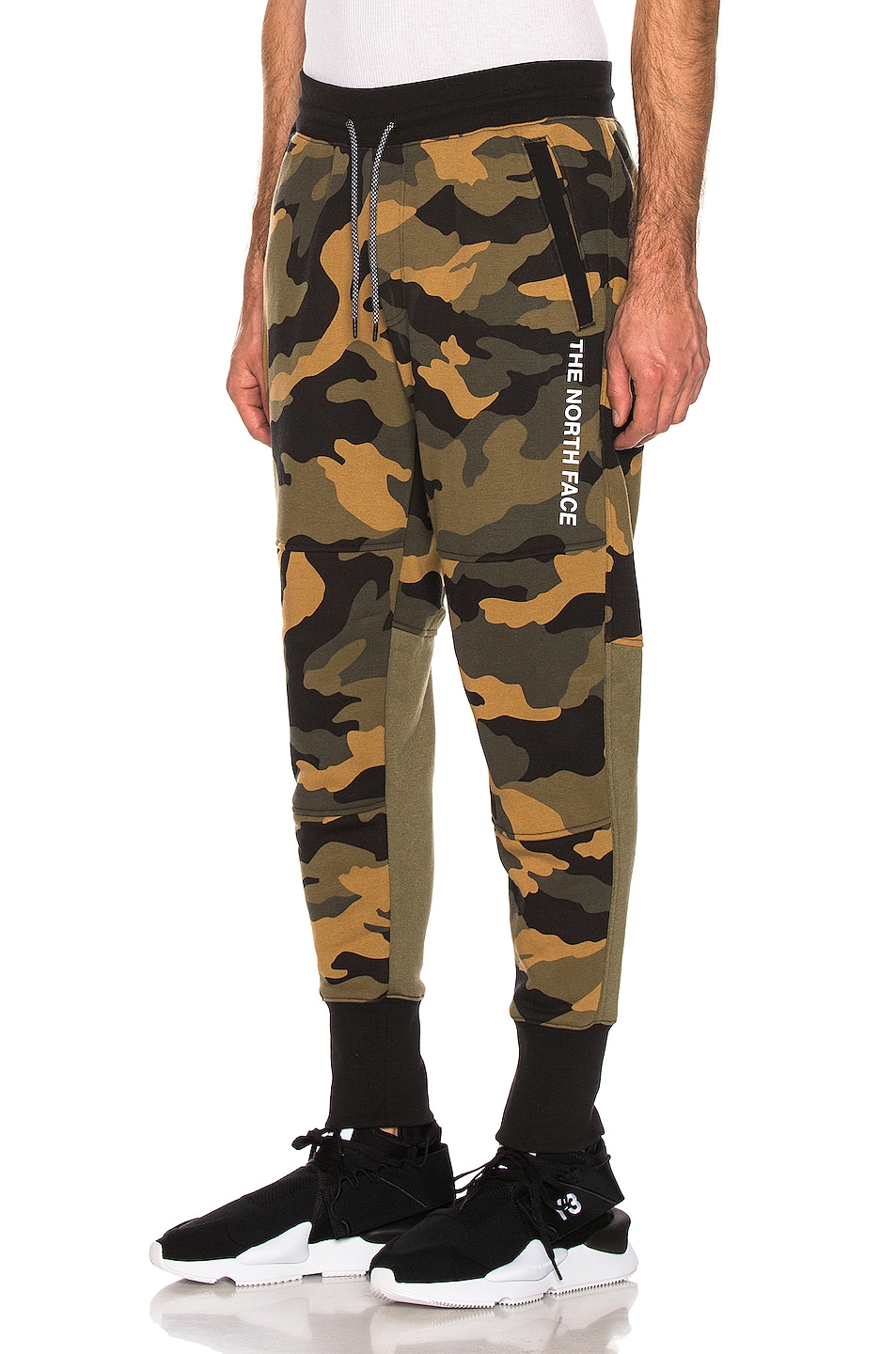 Image 1 of The North Face NSE Graphic Pant in Burnt Oliver Green Woods Camo Print