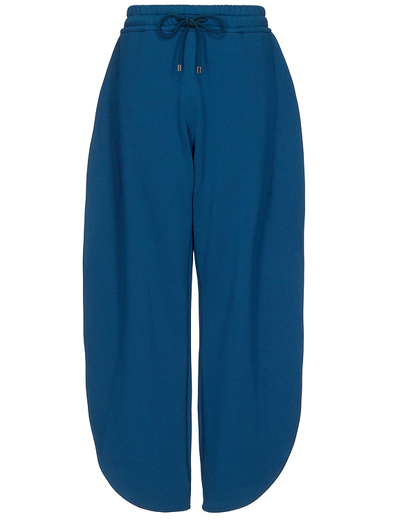 ALAÏA ALAΪA Petal Jogger in Petrole | FWRD