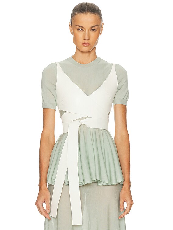アライア ALAIA ノースリーブニット38サイズ ALAÏA ALAΪA Cross Top in Blanc Nacre | FWRD