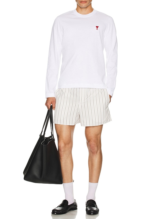 AMI｜ (Red ADC Long Sleeve T-Shirt(UTS235 724 221)) AMI Paris Red ADC Long Sleeve T-Shirt in White | FWRD