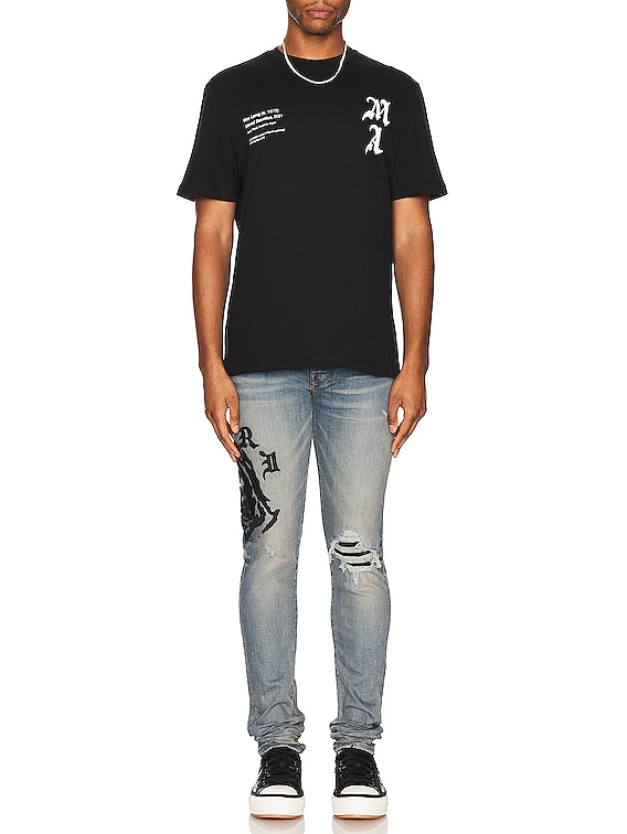 Amiri Wes Lang Reaper Logo Jean in Clay Indigo | FWRD