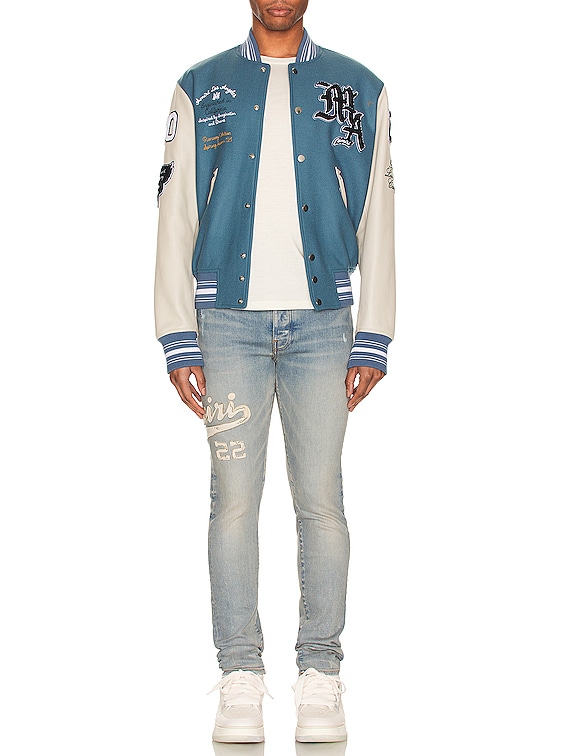 Amiri Varsity Applique Logo Skinny Jean in Clay Indigo | FWRD