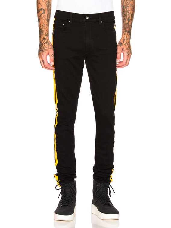 black and yellow amiri jeans