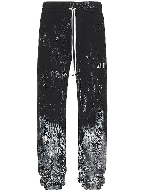 Amiri Cracked Dye Logo Sweatpants in Black | FWRD