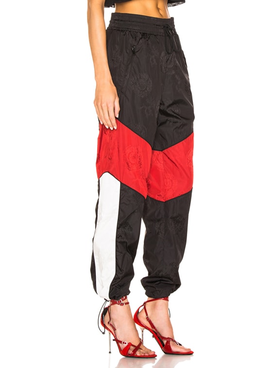 red black and white track pants