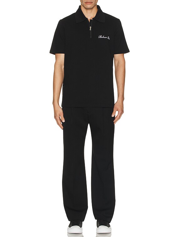 Tシャツ・カットソー BALMAIN BALMAIN SIGNATURE EMB ZIPPED POLO BALMAIN Signature Embroidered Zipped Polo in Black | FWRD