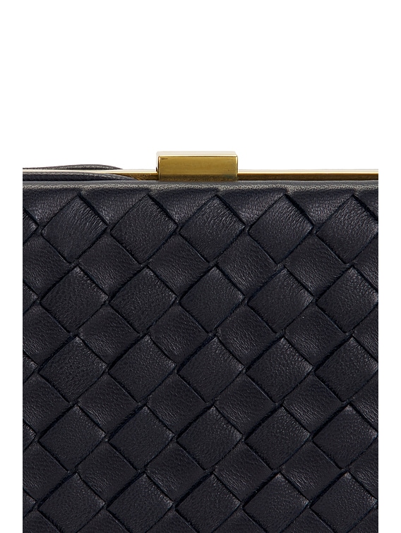 Bottega Veneta Mezzanotte Clutch in Midnight & Brass Vibrato | FWRD