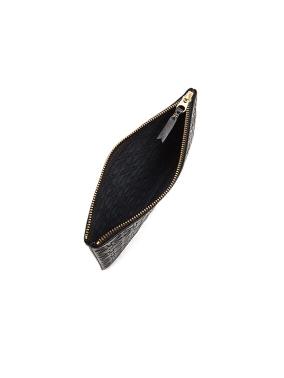 COMME des GARCONS Star Embossed Pouch in Black | FWRD COMME des GARCONS Star Embossed Pouch in Black | FWRD