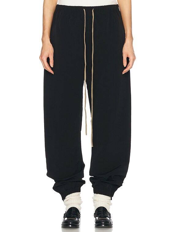 Fear of God ESSENTIALS Military Nylon Trackpant in Black | FWRD