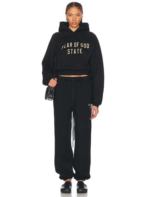 Fear of God ESSENTIALS Cropped Hoodie in Black | FWRD