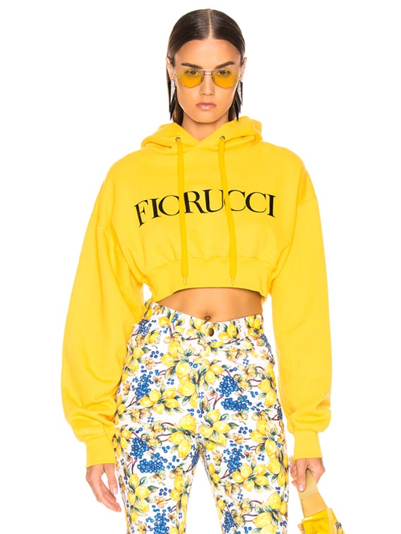 FIORUCCI Cropped Logo Sweatshirt in Mustard | FWRD