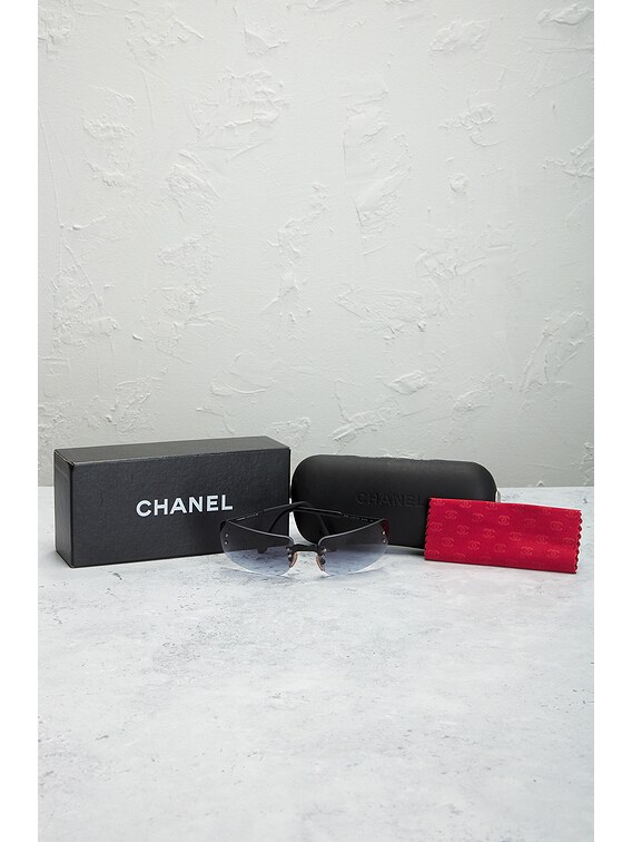 FWRD Renew Chanel Interlocking CC Logo Shield Sunglasses in FWRD Renew Chanel Interlocking CC Logo Shield Sunglasses in