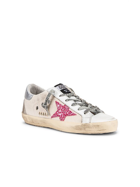 superstar sneakers with silver sparkle foxing and metal stud lettering