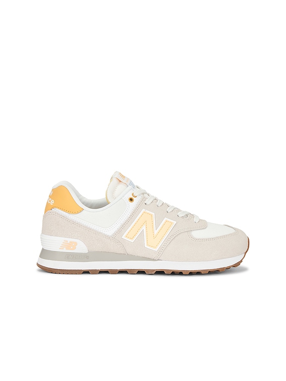 New Balance 574 Sneaker in Timberwolf & Alpha Orange | FWRD