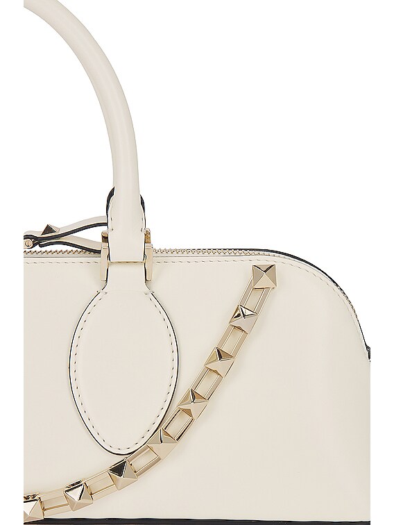 Valentino Garavani East West Rockstud Duffle Bag in Ivory | FWRD